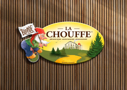 Oval LA CHOUFFE branded tin tacker with Marcel holding a 'Blonde' sign.