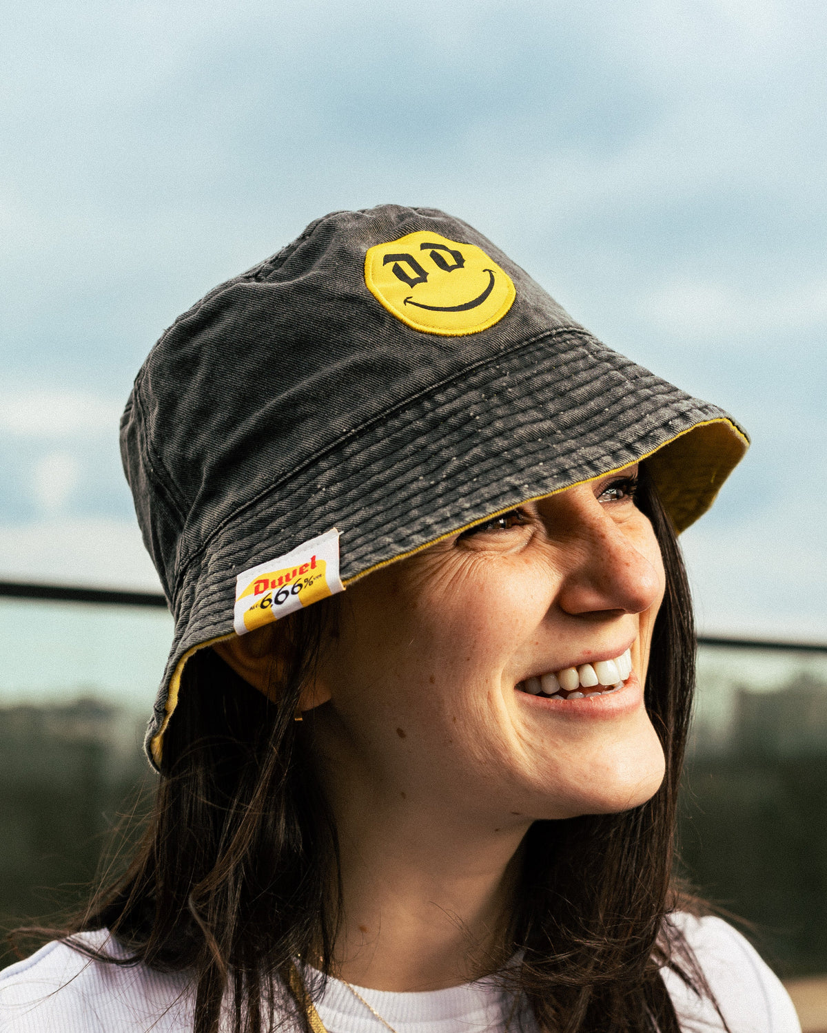 Woman wearing grey bucket hat