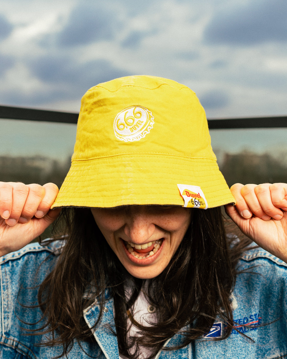 Woman wearing yellow bucket hat